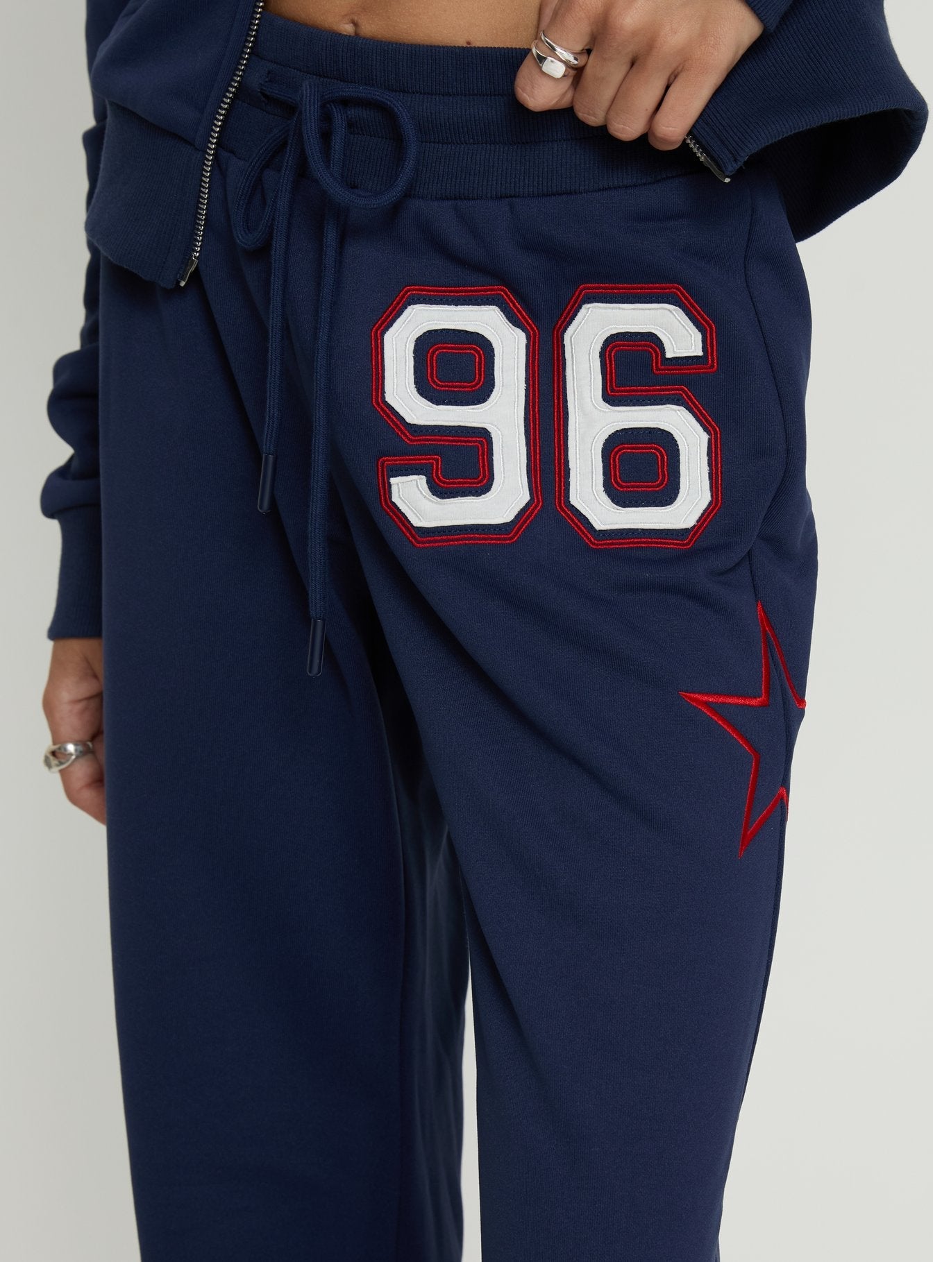 Kari Distressed Patch Track Pant Navy Multi
